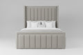 A modern upholstered bed with a tall channel-tufted headboard and matching footboard, dressed in white bedding and a gray throw blanket, shown in a minimalist bedroom setting.