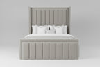 A modern upholstered bed with a tall channel-tufted headboard and matching footboard, dressed in white bedding and a gray throw blanket, shown in a minimalist bedroom setting.